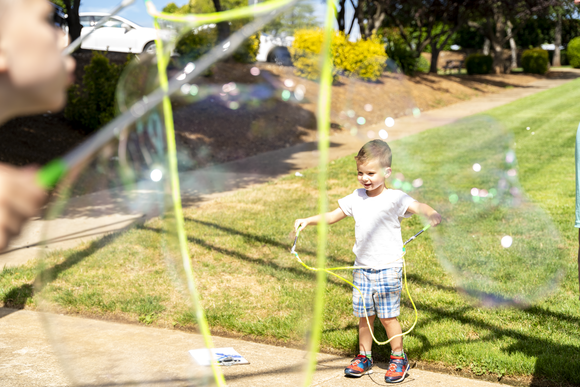 Child blowing bubble