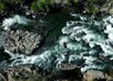 An aerial image of a rushing river