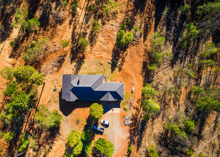 An aerial image of a home with proper defensible space