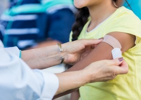 A person gets a vaccine