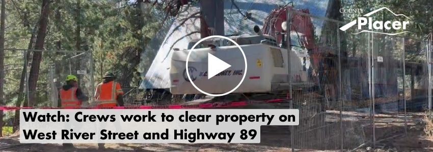 Crews work to clear the property at corner of West River Street and Highway 89