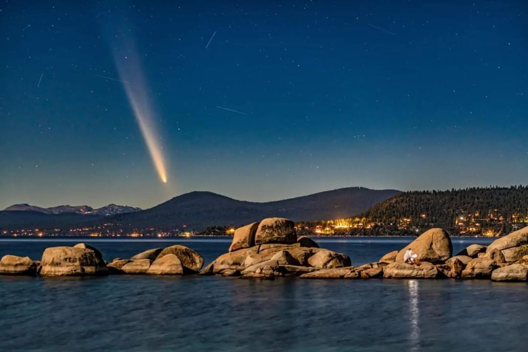 A photo of Comet Tsuchinshan-ATLAS, also known as C/2023 A3, above Speedboat Beach in North Lake Tahoe.