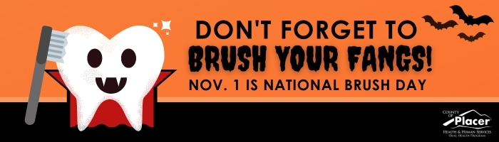 A cartoon tooth dressed as a vampire, holding a toothbrush. Text read, don’t forget to brush your fangs