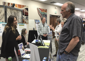 Two people discuss a topic at the May 2024 Discover and Discuss event in Kings Beach.
