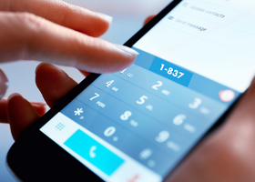 Person dialing 837 into a phone