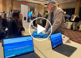 An image of a county employee talking with a Tahoe resident at this month's Discover and Discuss community event.