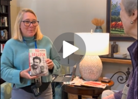 A LIbrary Mobile Services staff member shares a book with a resident at Eskaton Granite Bay. 