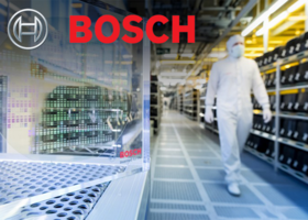 Photo of interior Bosch facility with person in hazmat suit. 