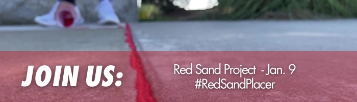 Image of red sand within regular sand 