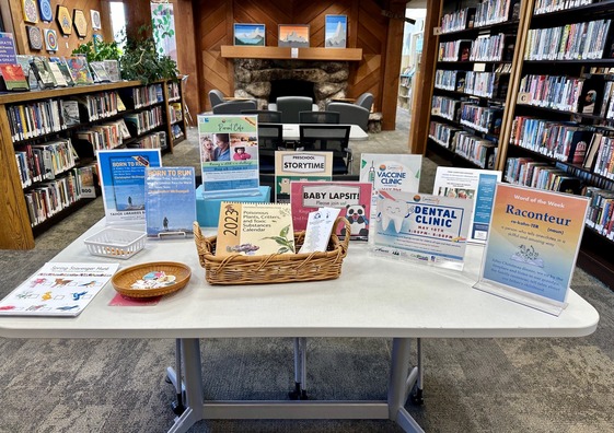 A table with activity flyers on it at the Tahoe City Library