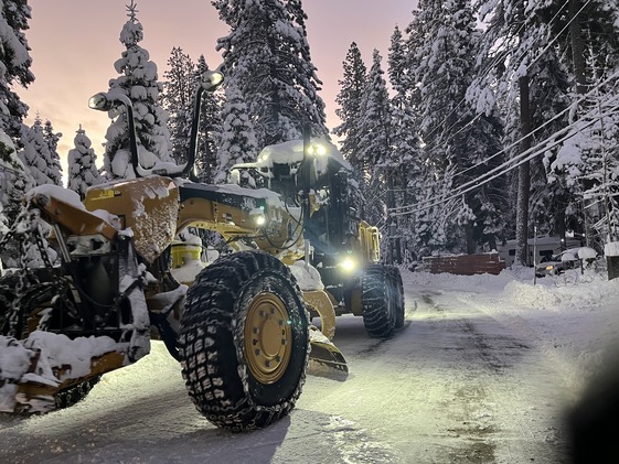 A CAT snow grater in North Lake Tahoe region pushing snow.