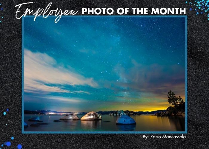 A nighttime photo of stars above Lake Tahoe outlined in black with text: Employee Photo of the Month by Zario Mancassola 
