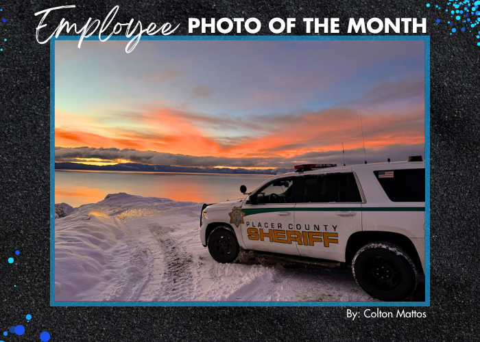 A photo of a Placer County Sheriff's Office vehicle in front of Lake Tahoe with a sunset by: Colton Mattos.