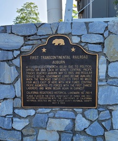 Large brass plaque on a stone wall