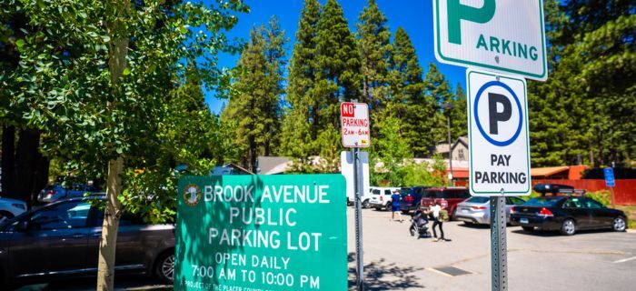 An image of Brook Avenue pay parking signs and the lot in Kings Beach