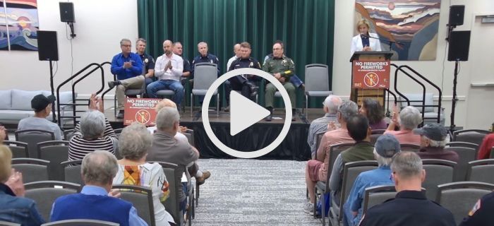 An image of the crowd and speakers inside the North Tahoe Event Center for the town hall event.