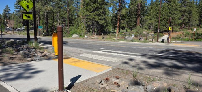 An image of a worn road and white-painted crosswalk near Kings Beach.