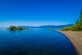 An image of Lake Forest Beach and the blue waters of Lake Tahoe.