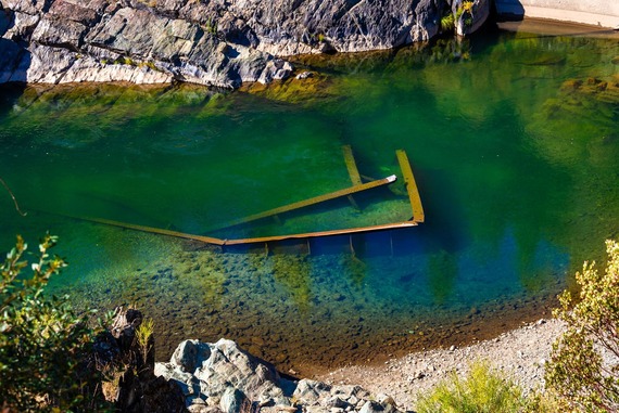 Bridge debris poking out of the American River