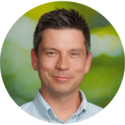 A profile image of STR Manager Doug Jastrow on a green background.