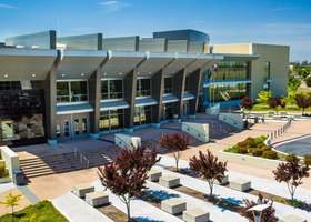 The silver building front of the Placer County Superior Court in Roseville on a sunny, blue-sky day.