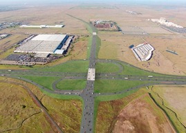 A rendering of the intersection of two major roads amid commercial buildings