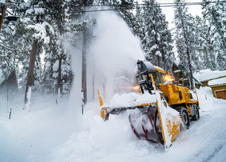 A yellow snow blower in North Lake Tahoe