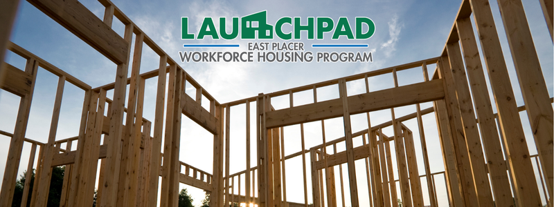 An image of home construction with a Launchpad program logo