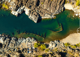 A view of the American River where workers have removed debris. Excavators continue to pull small pieces of rebar from the river bottom.