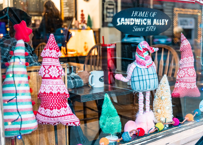 Looking through a cafe window decorated for holidays