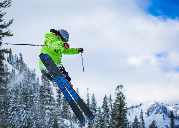 man on skis flies through the air