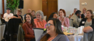 People in crowd at chamber breakfast.