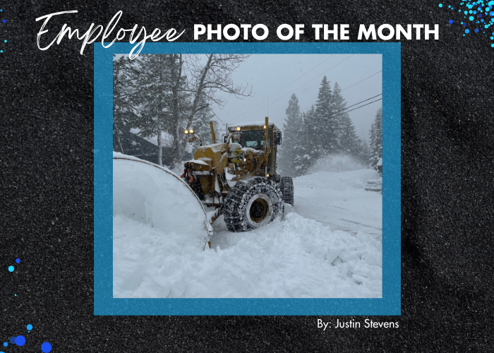 Employee photo of the month: A snowplow turning and pushing snow. 