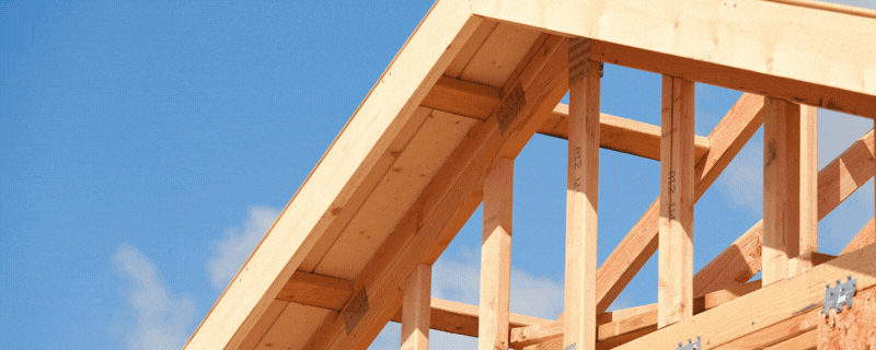 A wooden framed home with blue sky and text: $3 million available to build workforce housing in North Lake Tahoe.