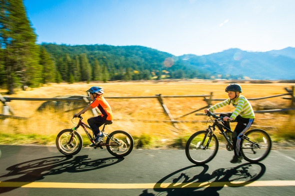 2 kids on a bike trial zoomin