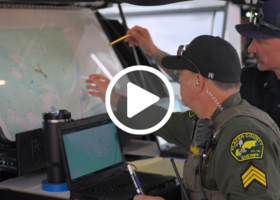 Members from the Placer County Sheriff’s Office and CAL FIRE NEU/Placer County Fire look at a map.