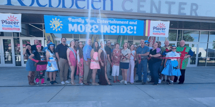 A large group cuts the ribbon to open the 2026 Placer County Fair