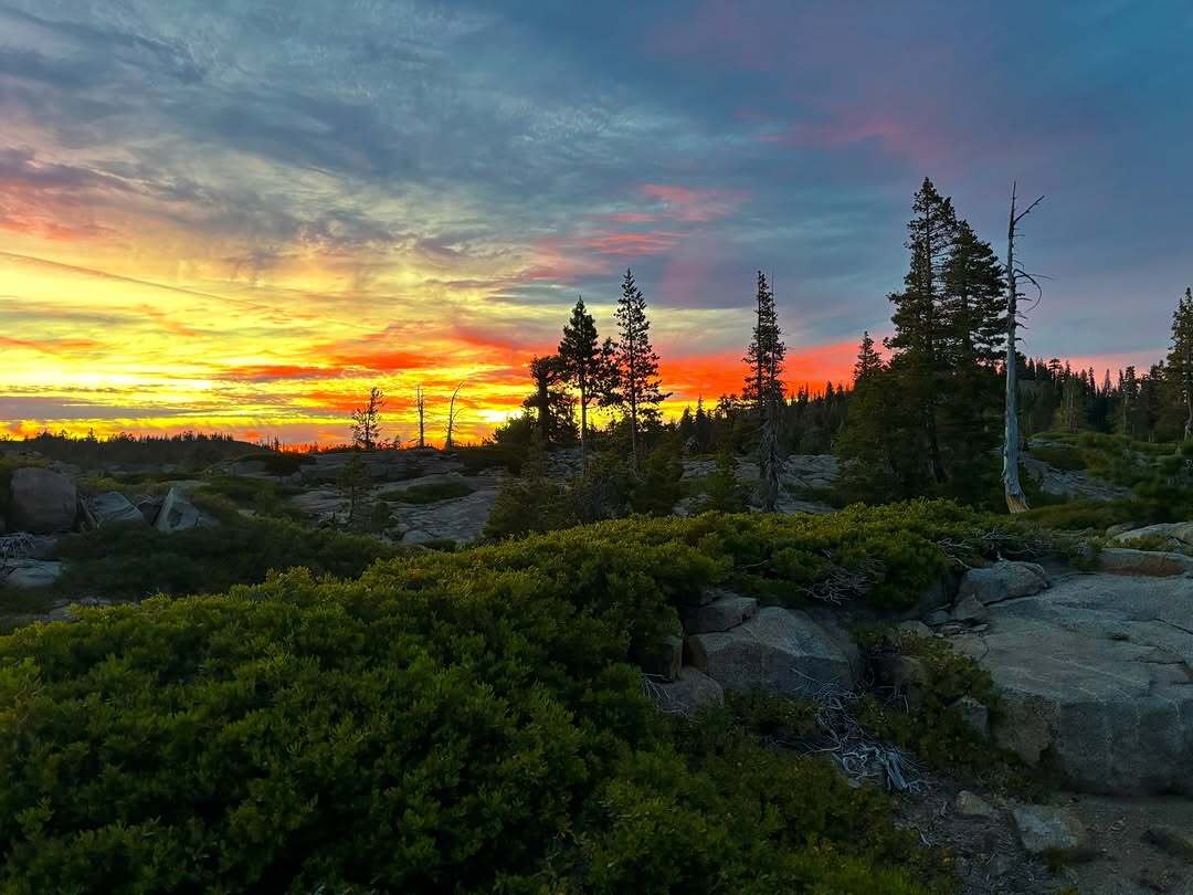 Sunset photo in Loch Levans Lake with trees and greenery