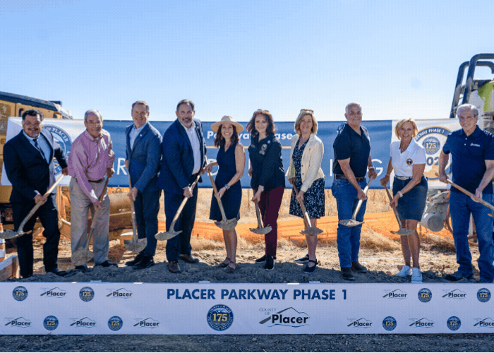 Placer County supervisors and dignitaries holding shovels of dirt, and an aerial rendering of the future Placer Parkway project.