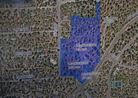 Map of Dollar Hill with roads and trees in North Lake Tahoe with a blue box and outline around the former Dollar Creek Crossing development site.