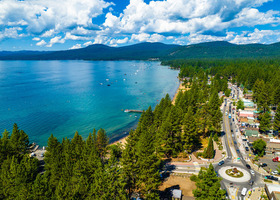 The shoreline of Lake Tahoe along the town of Kings Beach on a sunny day