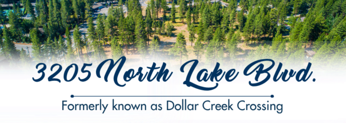 Green trees on the property at 3205 North Lake Blvd. with blue text: Formerly Dollar Creek Crossing.