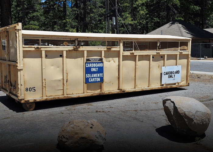 Recycling bins in Kings Beach with text: Bulk recycling now in Kings Beach. Click to learn more.