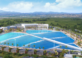 An artists rendering of the 5-acre surf lagoon and the proposed hotel in the backdrop