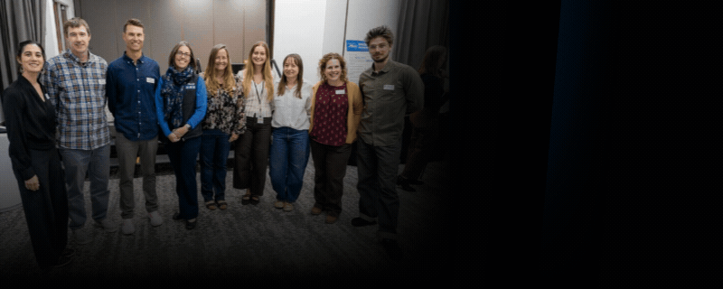 Black background with images of people smiling at the 2026 Discover and Discuss Community Event in Kings Beach with a play button and white text.