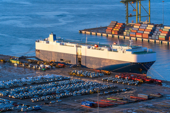 Auto carrier ship anchored at a terminal