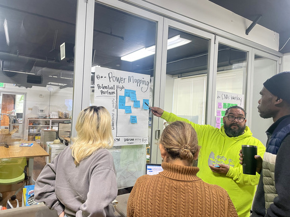 Program participants discuss project