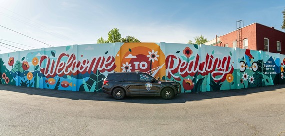 Redding Police Car In Front of Welcome to Redding Mural 