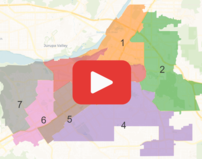 Redistricting map graphic with video play button