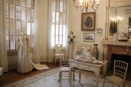 Heritage House's parlor room with wedding dress
